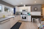 Kitchen features full size appliances including a dishwasher